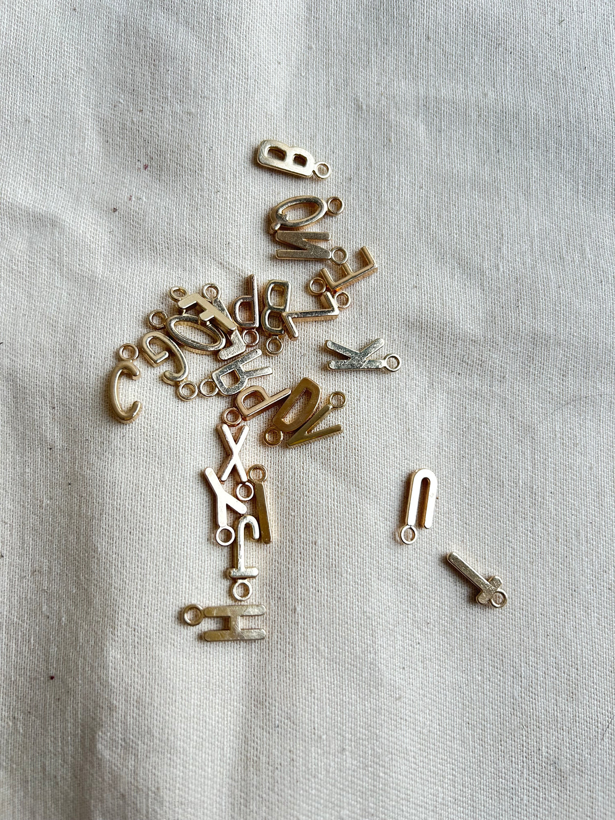 Golden initial charms for journal customization