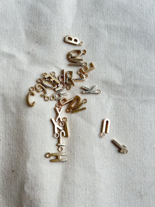 Golden initial charms for journal customization